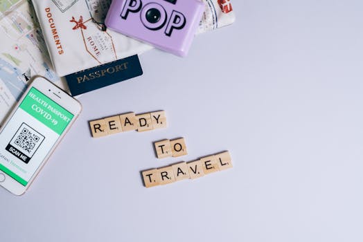 Travel essentials including passport, map, and health passport app ready for post-pandemic journeys.