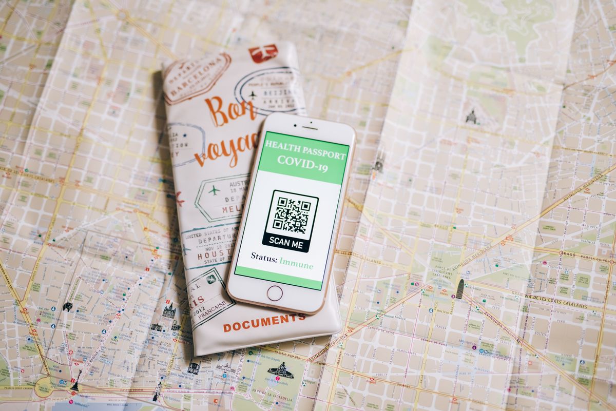 Smartphone placed on a printed map for route planning