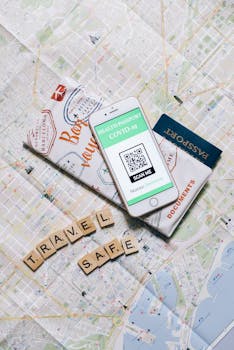 Smartphone displaying COVID-19 health passport on map indicating safe travel.