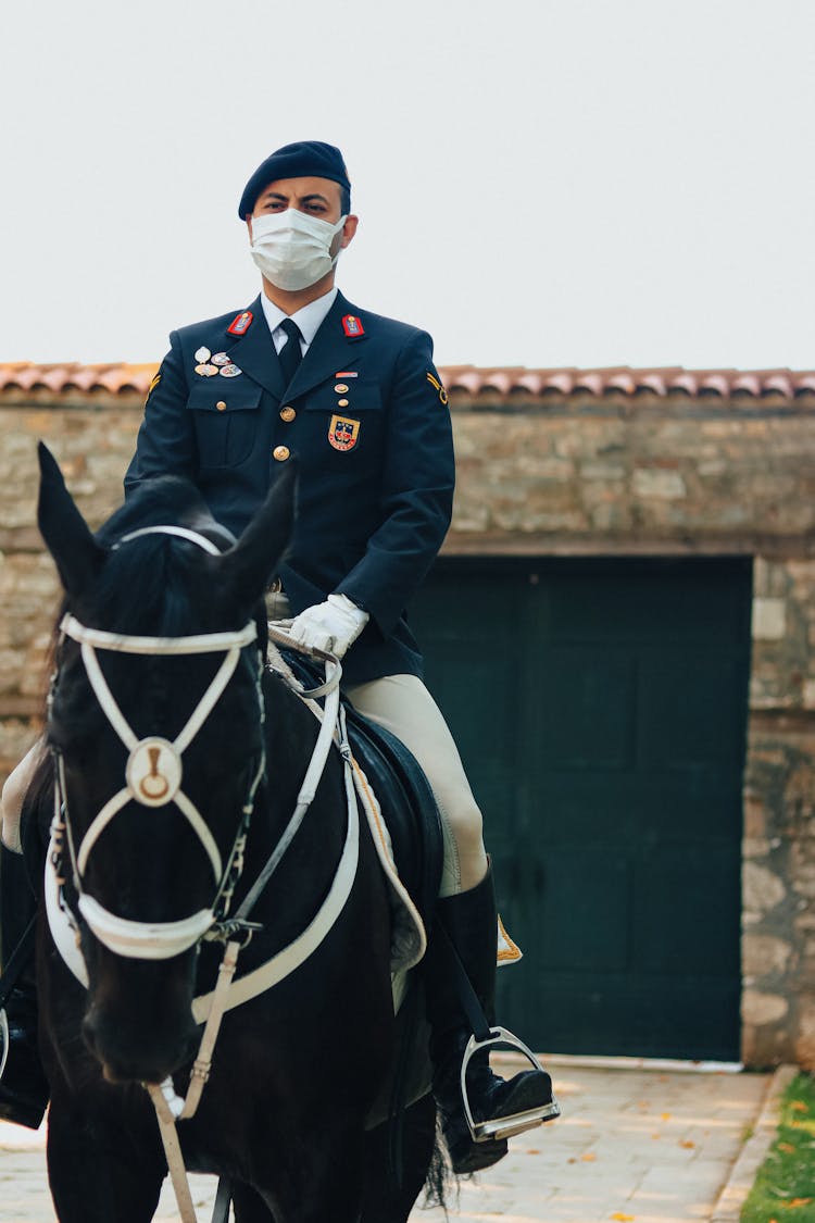 Soldier Riding On A Horse With Face Mask On 