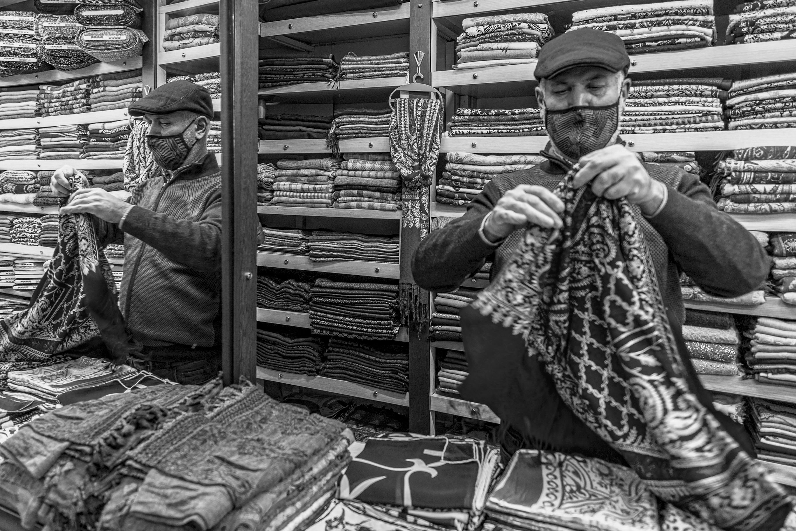 Retail display racks with traditional and patent-pending folding mechanisms in a London office setting
