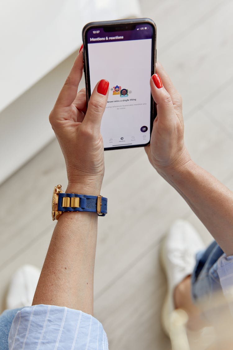 Hands Holding A Cellphone With Message