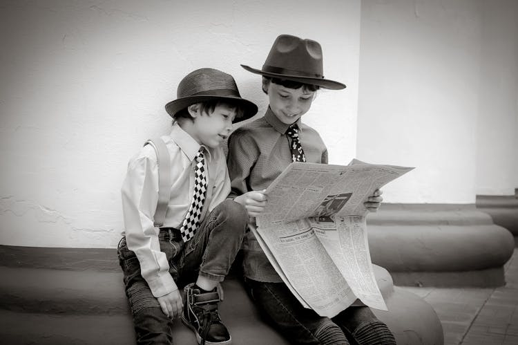 Boys Reading Newspaper