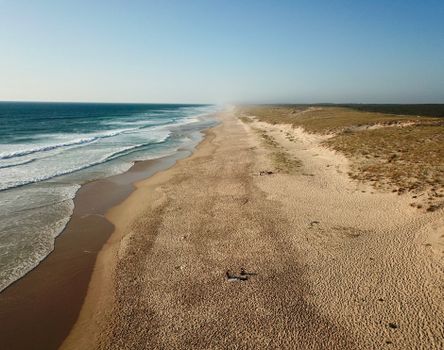 Drone capture of a vast sandy beach in Nouvelle-Aquitaine, France, showcasing tranquil coastal scenery.