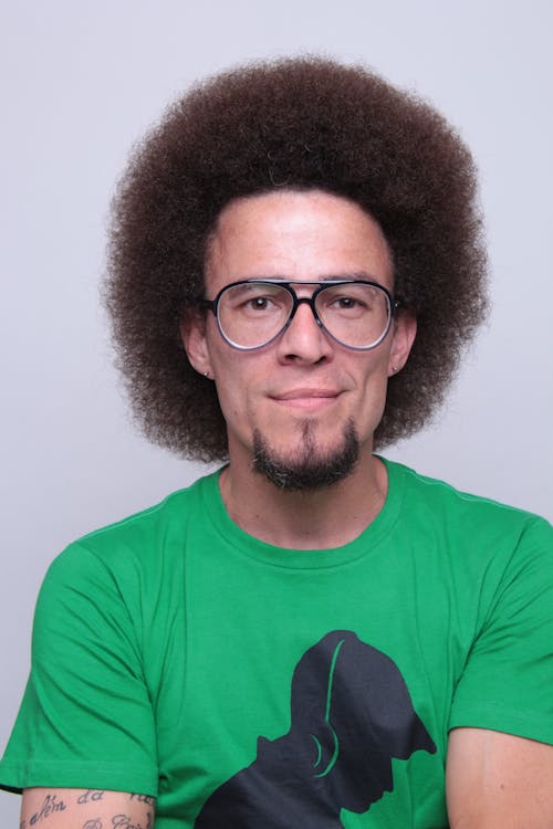 Free Portrait of a Man with Afro Hair and Eyeglasses Stock Photo