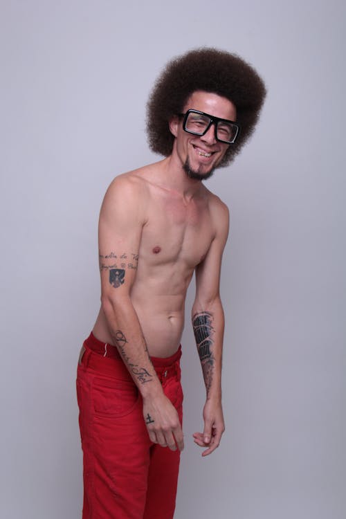 Free A Shirtless Man With Afro Hair  Stock Photo