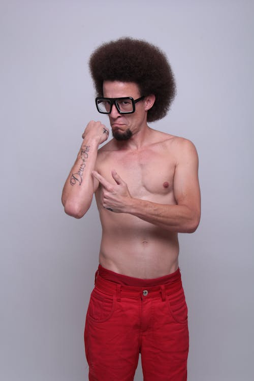 Free A Topless Man in Red Pants Stock Photo