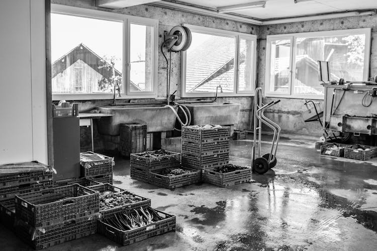 A Grayscale Interior Of A Factory