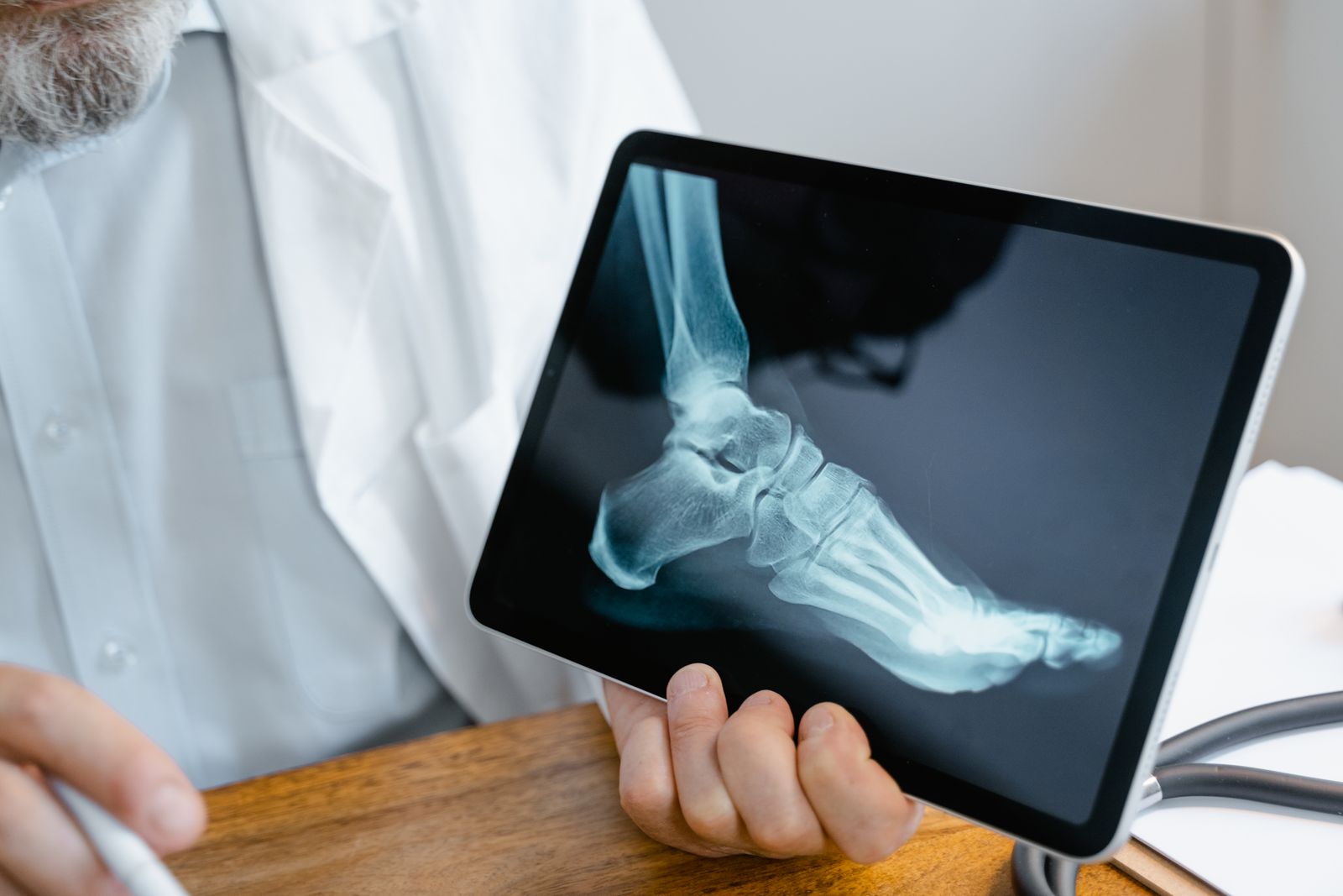 Bright close-up of a person checking foot and ankle comfort before walking