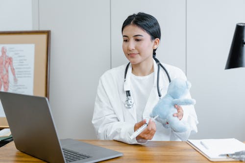 A Female Doctor Giving Online Consultation