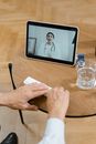 Person Holding Black Tablet Computer