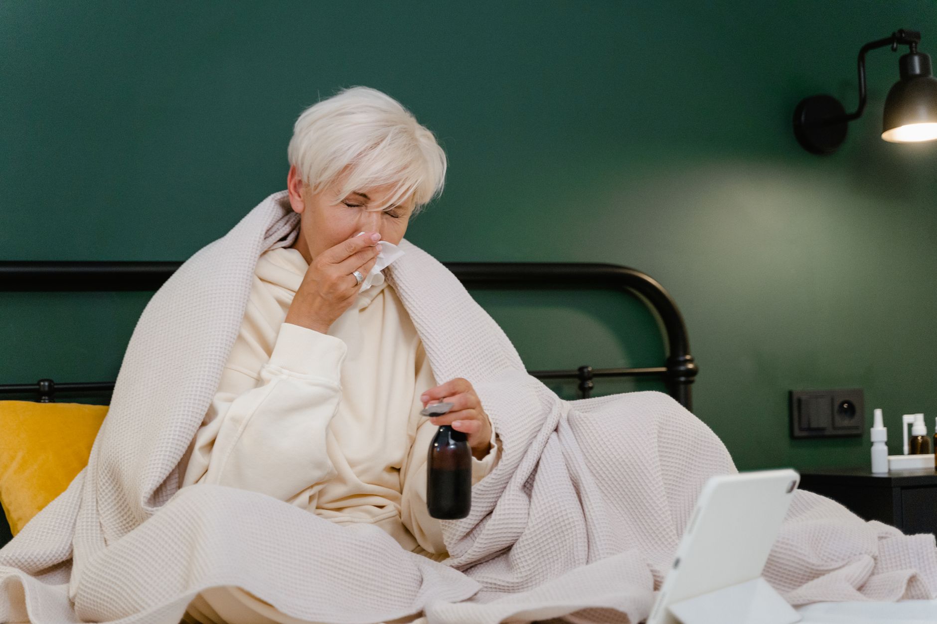 Person reading a medicine label closely to ensure safe dosage