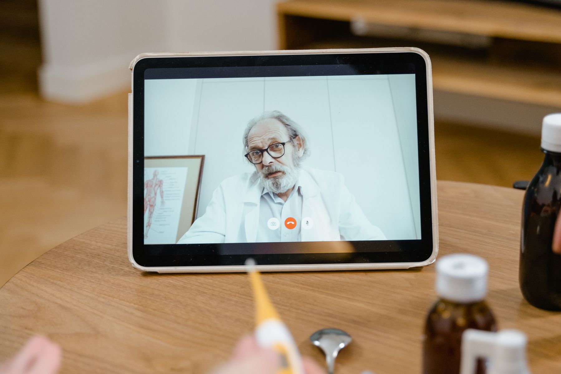 Healthcare professional using a phone or front-desk technology in a modern practice