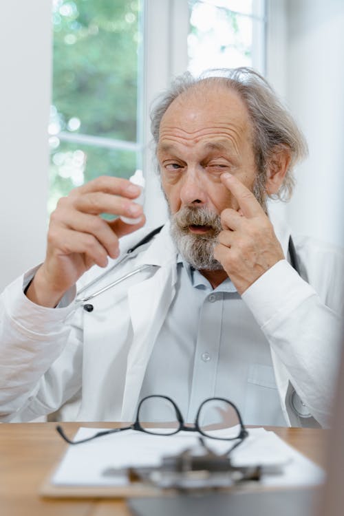 A Doctor Using Eyedrops 