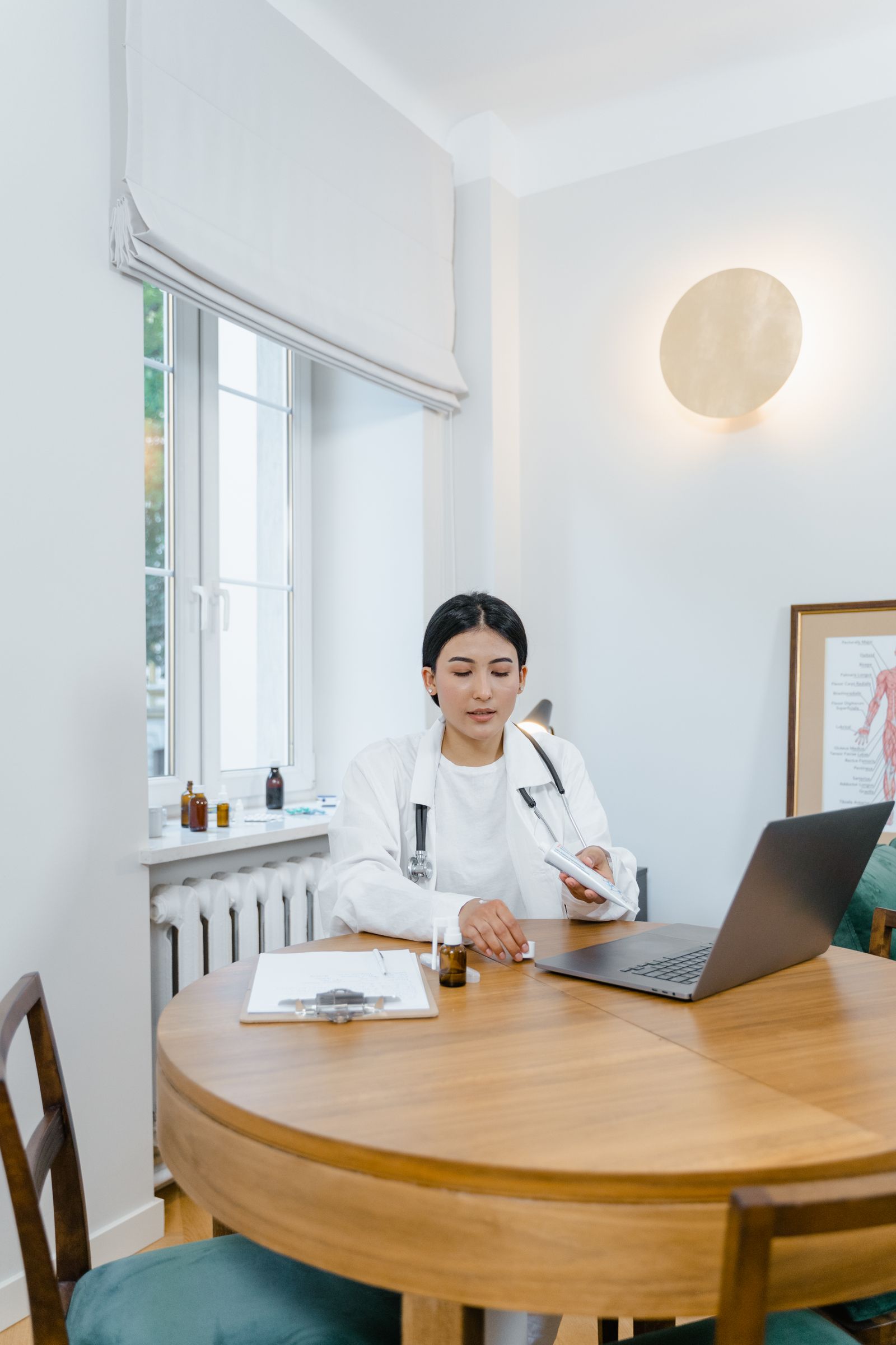 Healthcare professional conducting an online consultation from a laptop