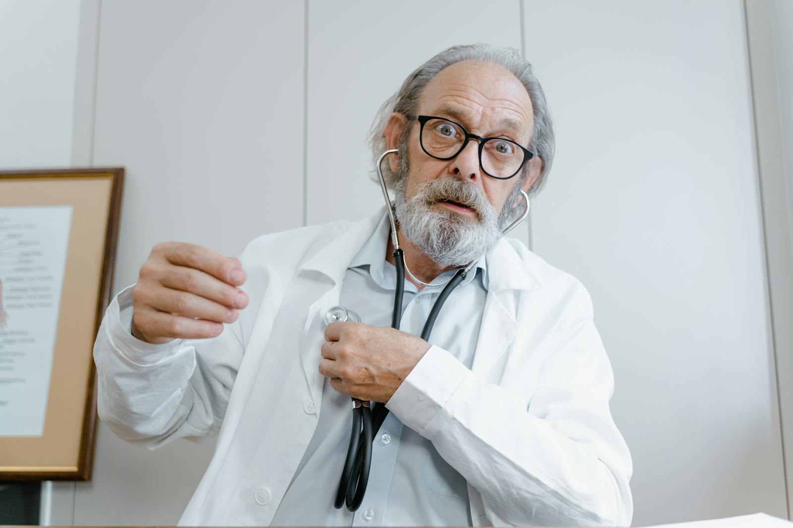 Parent holding a baby while speaking with a pediatrician