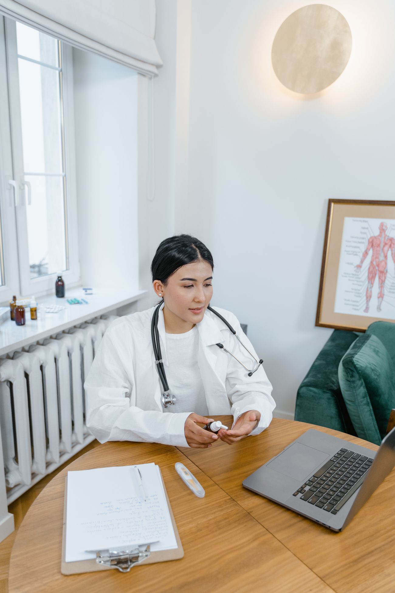Doctor working from a medical office using a laptop