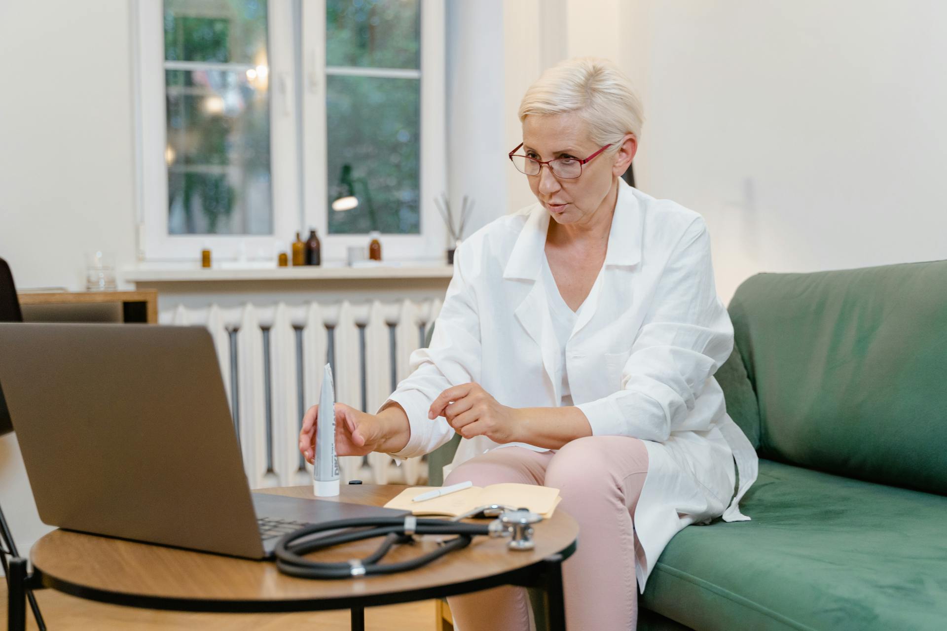 A Female Doctor Giving Online Consultation