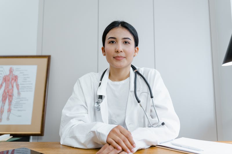 Healthcare professional using advanced medical technology and AI systems for patient care