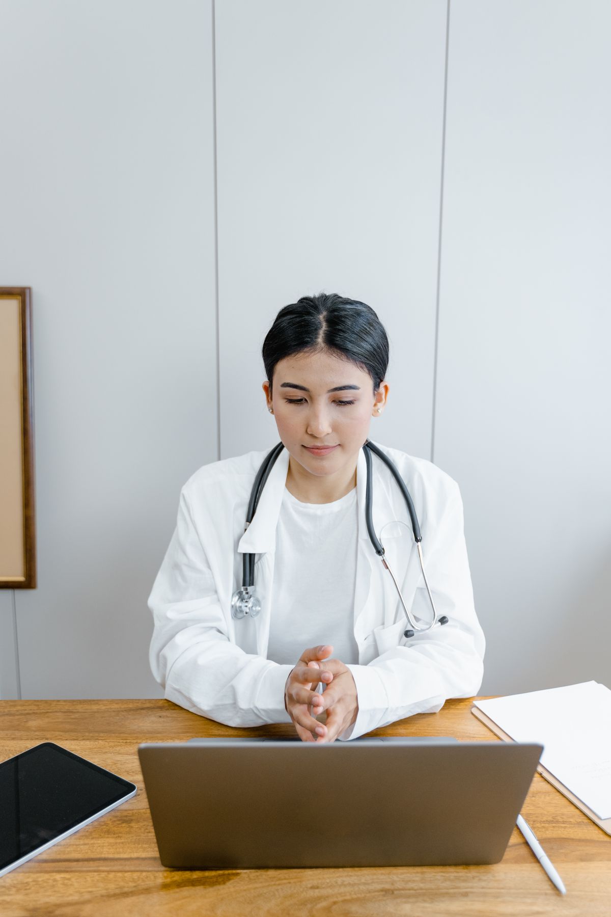 Patient reviewing clinic credentials and treatment information