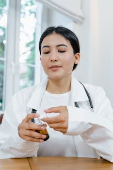 Female doctor holding a medicine bottle in a modern clinic setting.
