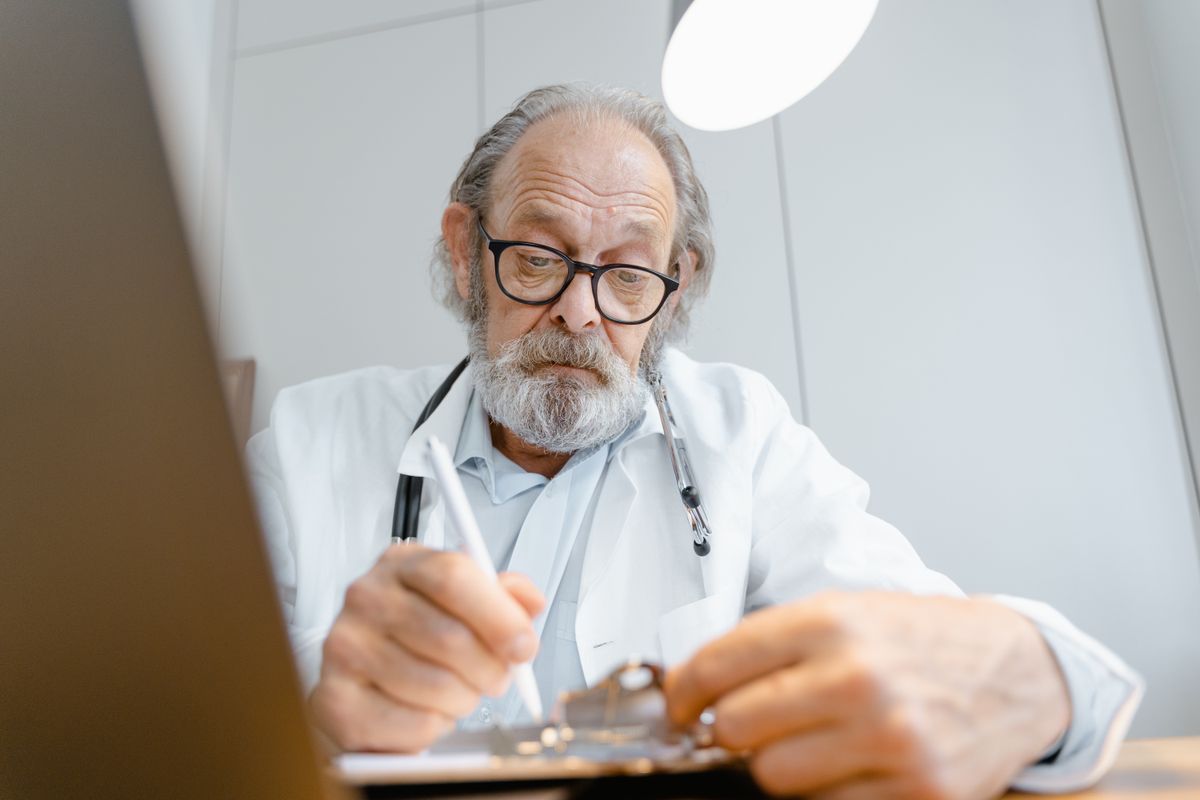 Doctor and patient reviewing healthcare options in a modern outpatient clinic