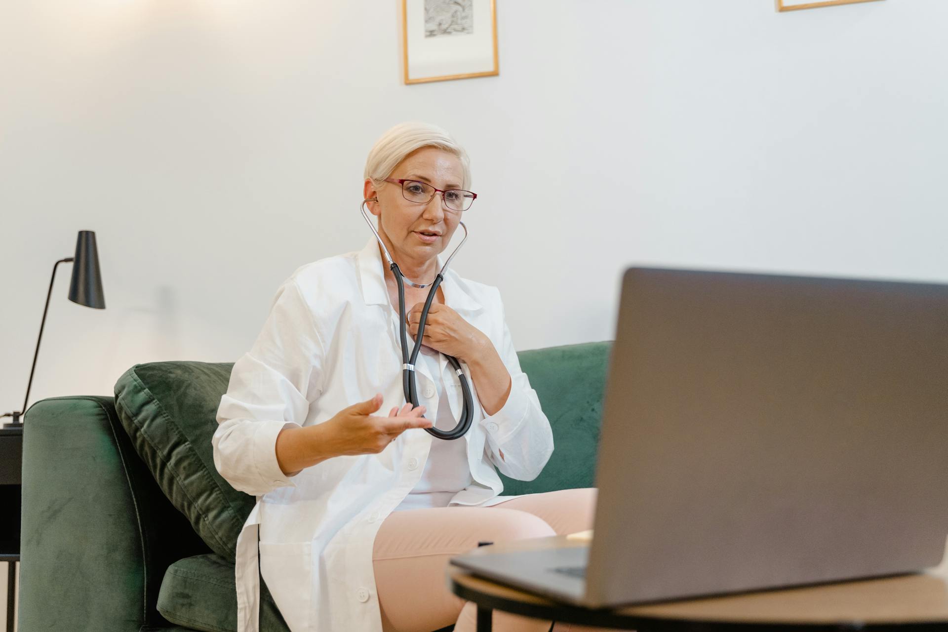 Professional female doctor using telemedicine technology for a virtual consultation. Ideal for healthcare themes.