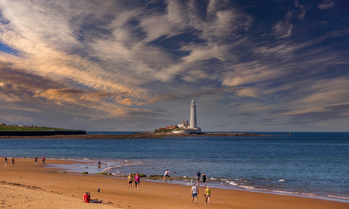 Person wearing a modern mixed reality headset in a minimal workspace