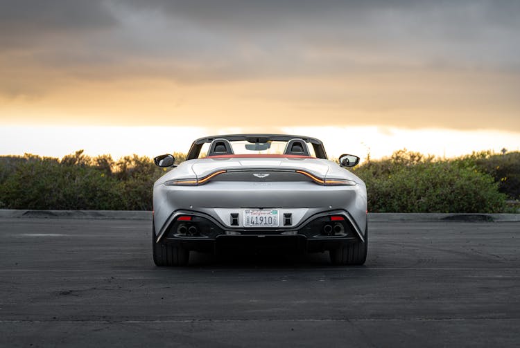 Gray Aston Martin On The Road During Sunset