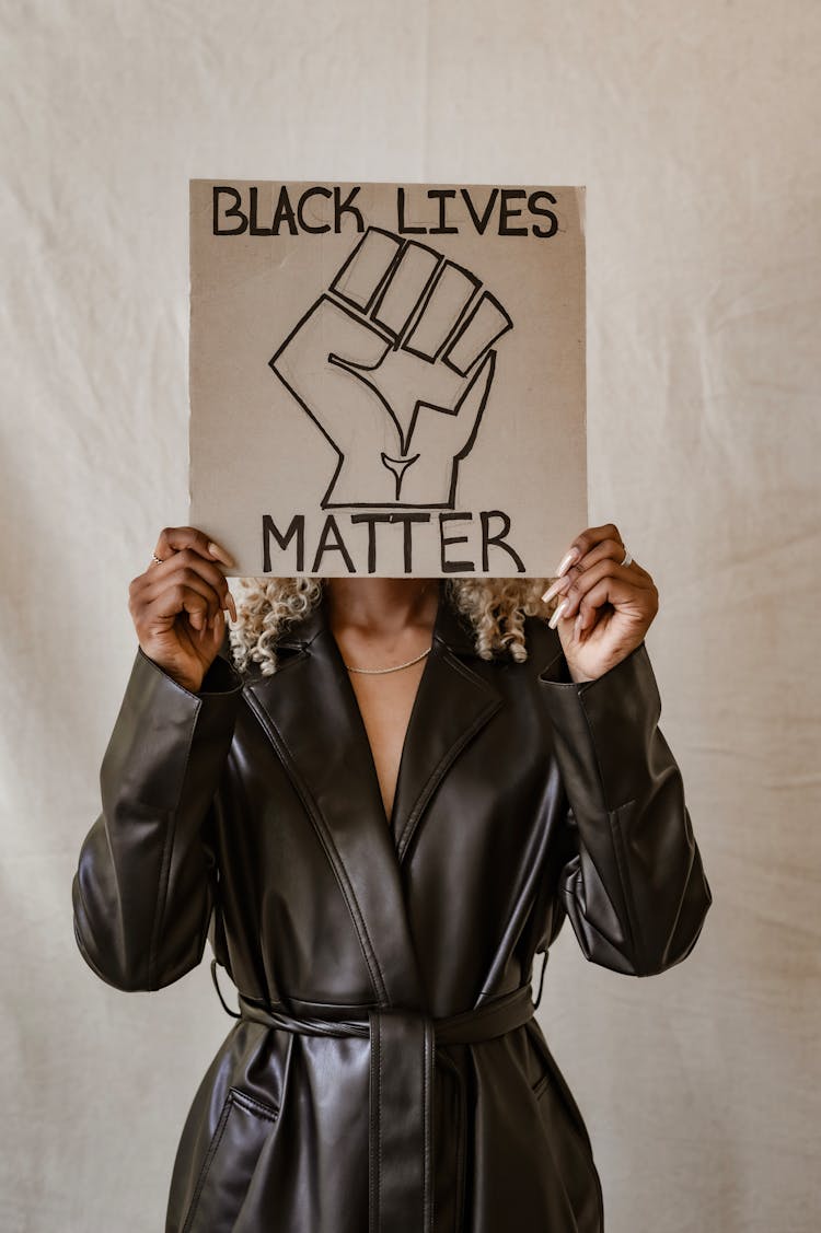 Person Holding A Placard