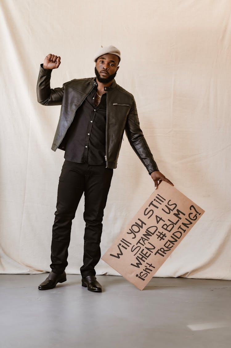 Man With A Black Life Matters Banner