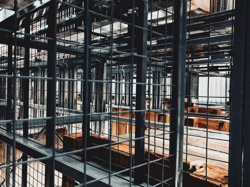 warehouse manager reviewing inventory system dashboard for import tracking