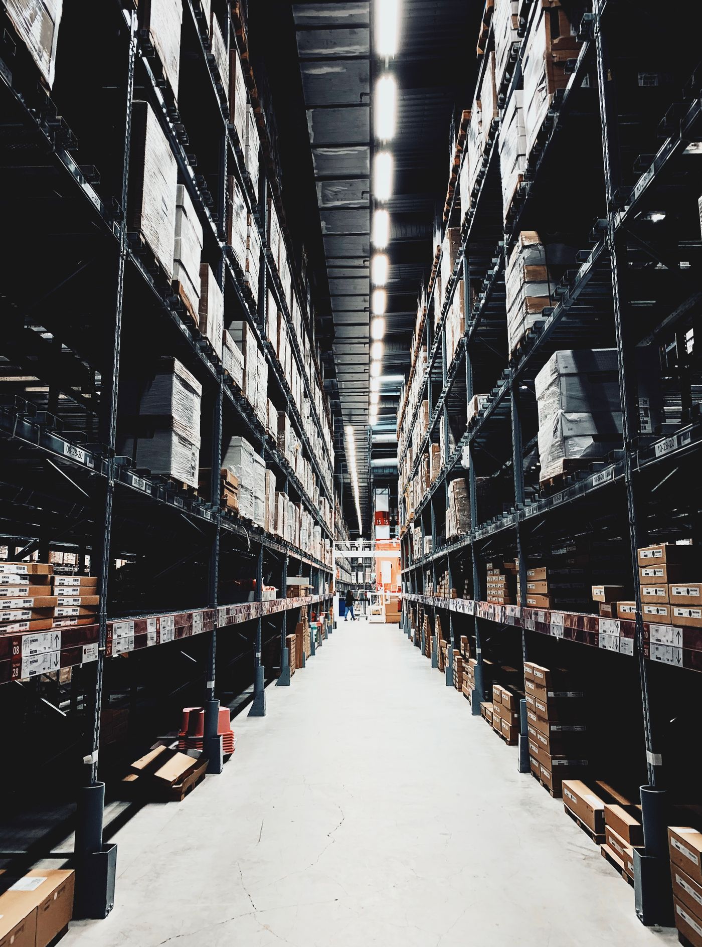 Wide aisle inside a modern retail distribution warehouse