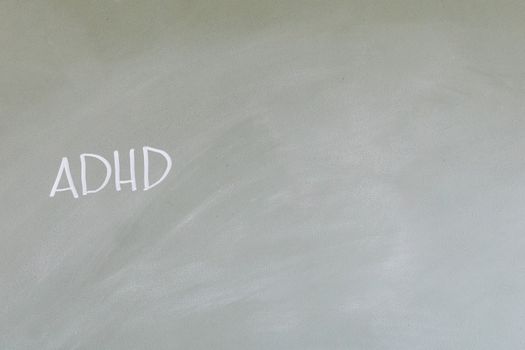 Simple depiction of ADHD awareness with text on a chalkboard.