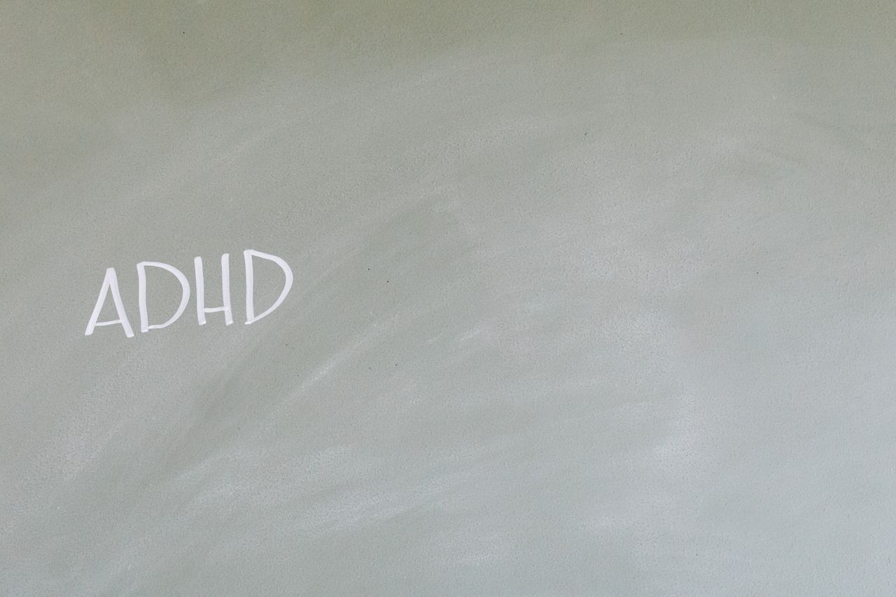 simple depiction of adhd awareness with text on a chalkboard