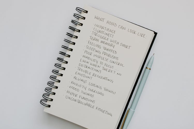 A List Of Disorder Signs Written On A Notebook