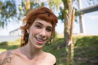 Smiling Woman in Brown Tank Top