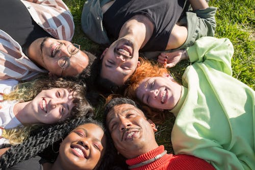 Friends Lying Down on Grass