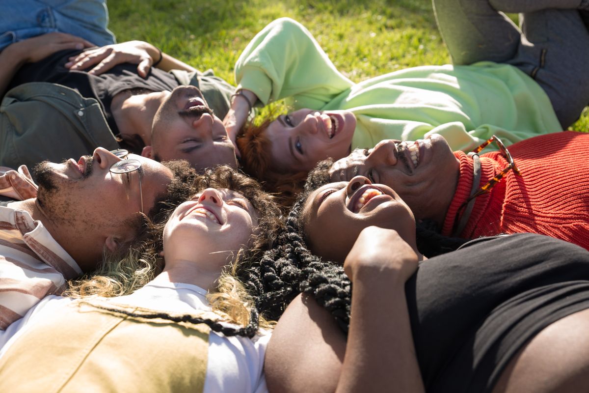 A group of friends laughing together outdoors