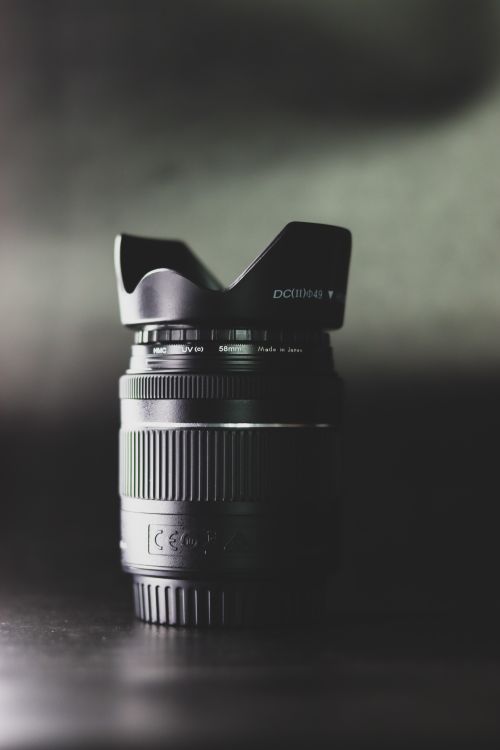 Free Detailed shot of a black camera lens with a blurred background, ideal for photography themes. Stock Photo
