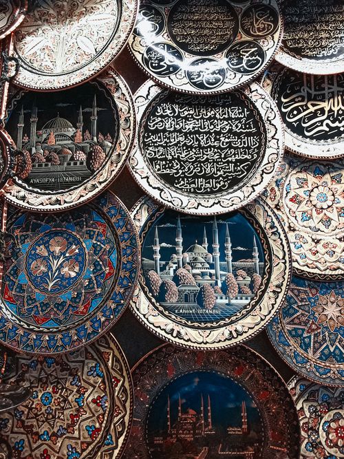 Free Close-up of ornate plates with Islamic designs and script, showcasing traditional craftsmanship. Stock Photo
