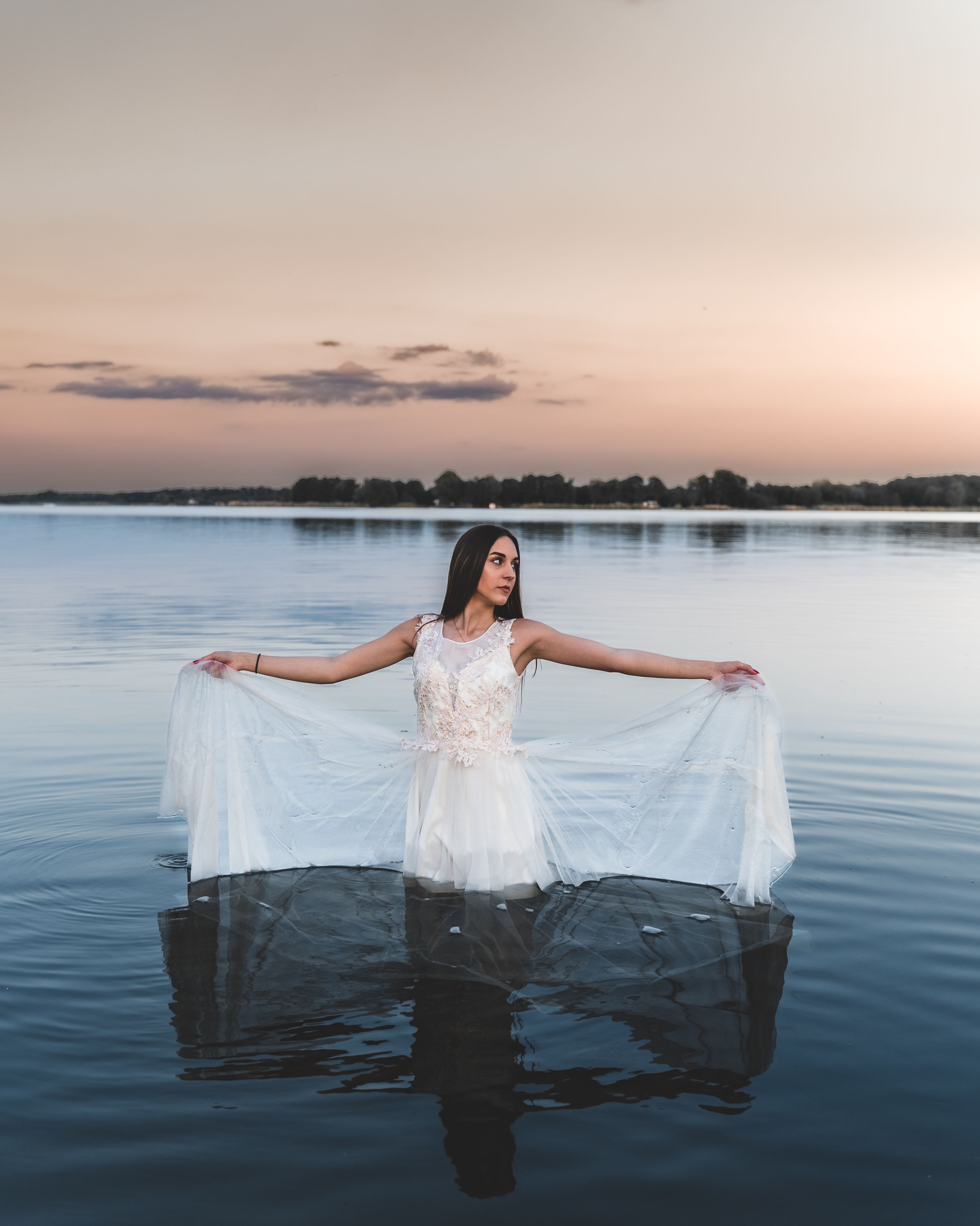 A Woman Wearing White Dress Standing in the Water · Free Stock Photo