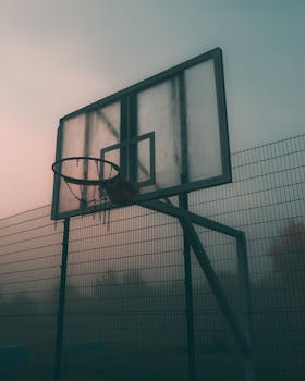 Moody shot of a basketball hoop on a foggy morning in Moscow, Russia.