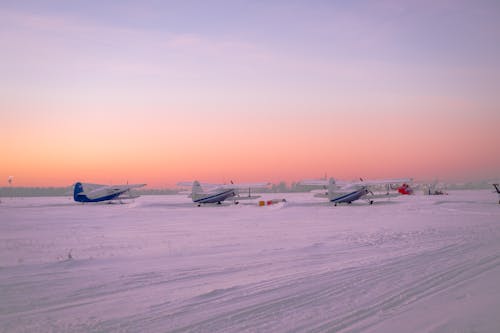 Airplanes on Snow Covered Ground