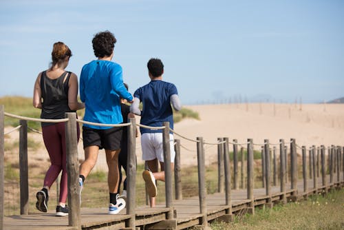 Free People Jogging at the Beach Stock Photo