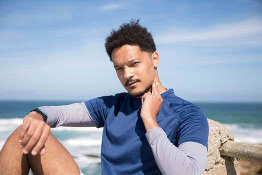 Man in Blue Shirt Checking His Pulse