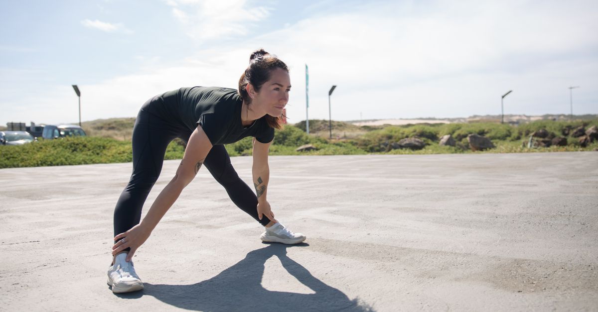 athlete stretching in morning light, showing stiffness
