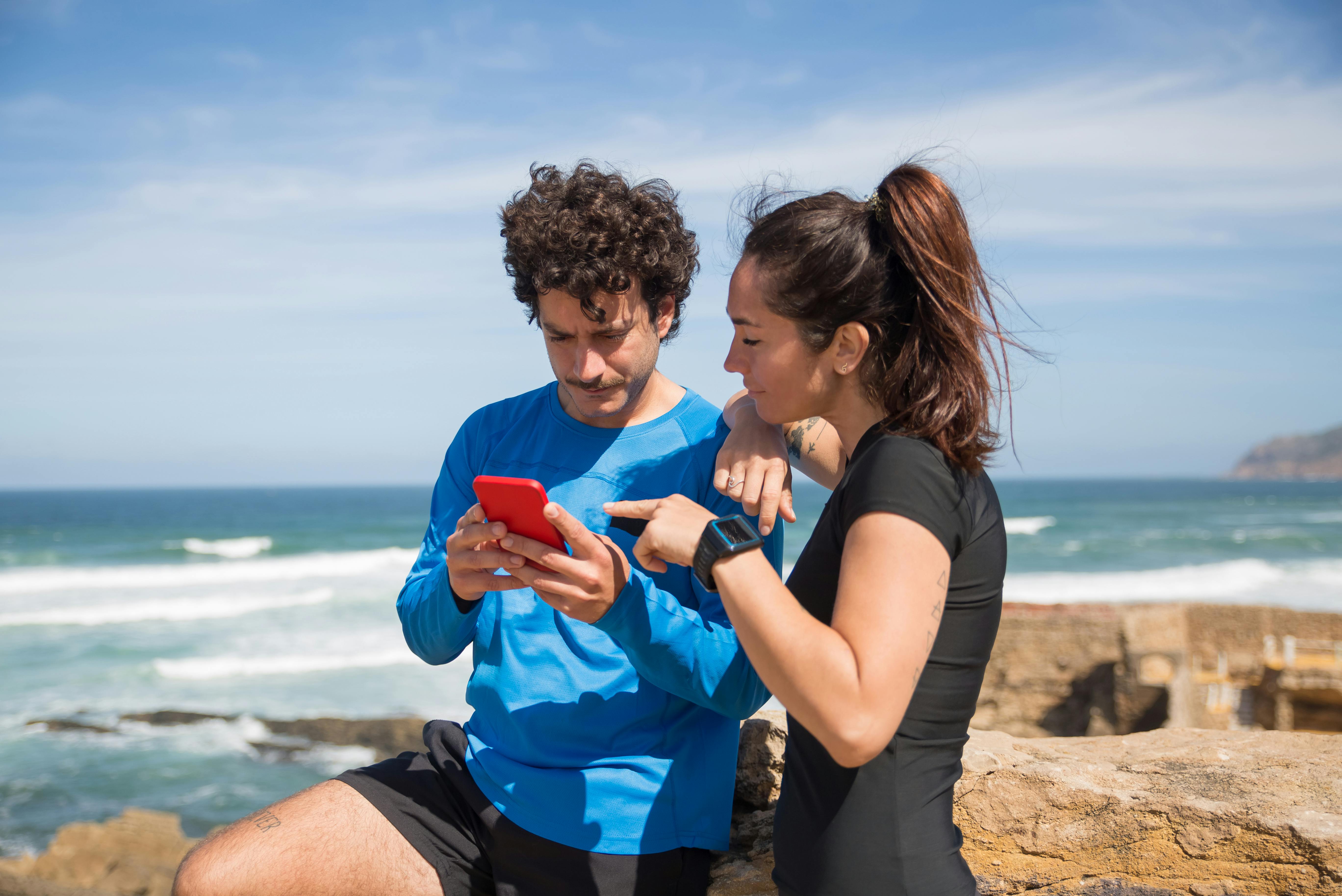 Couple walking hand in hand in a serene, natural setting, enjoying each other’s company without devices.