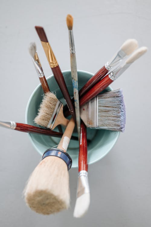 Top View of Different Paint Brushes on a Container 