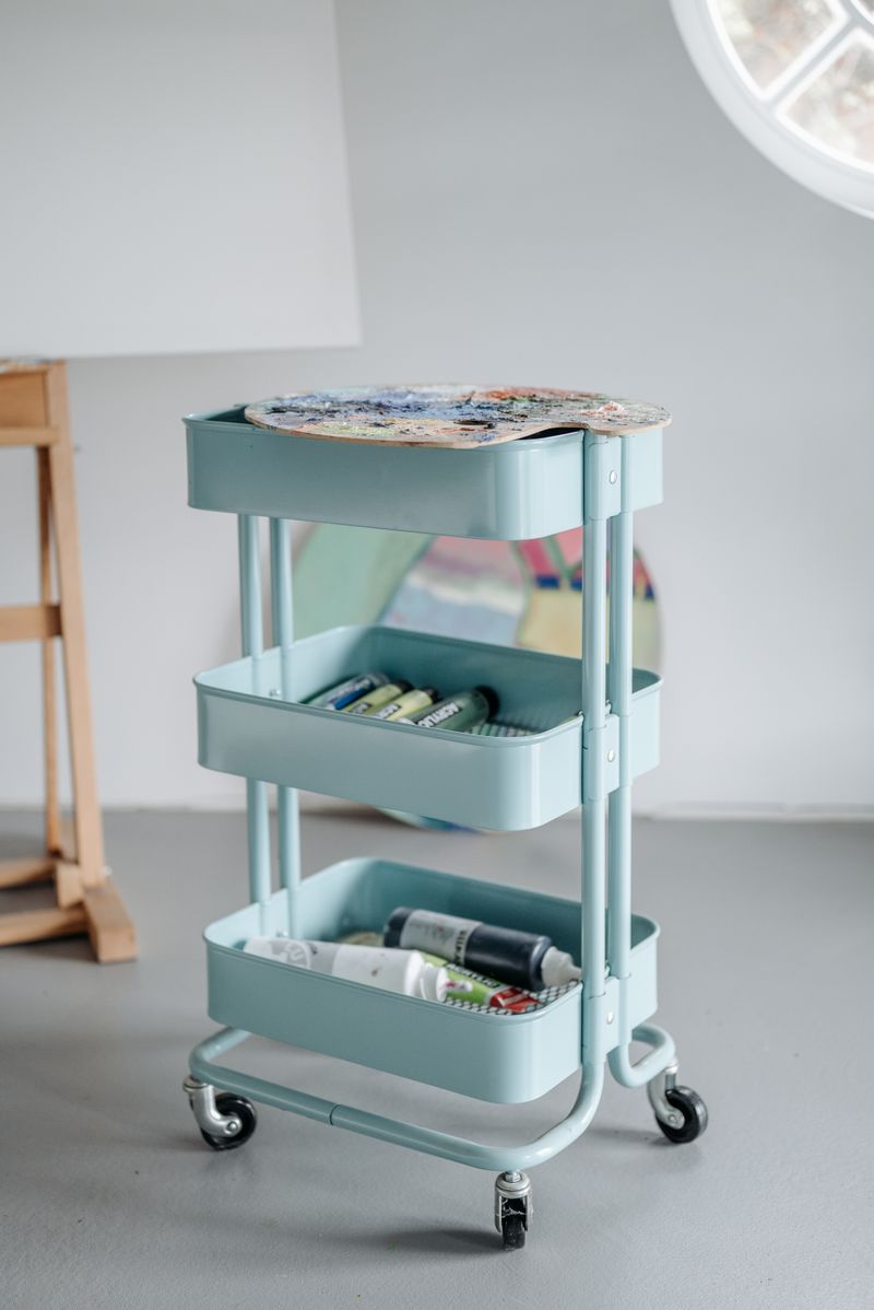 Rolling multi-tier utility cart neatly organized with supplies